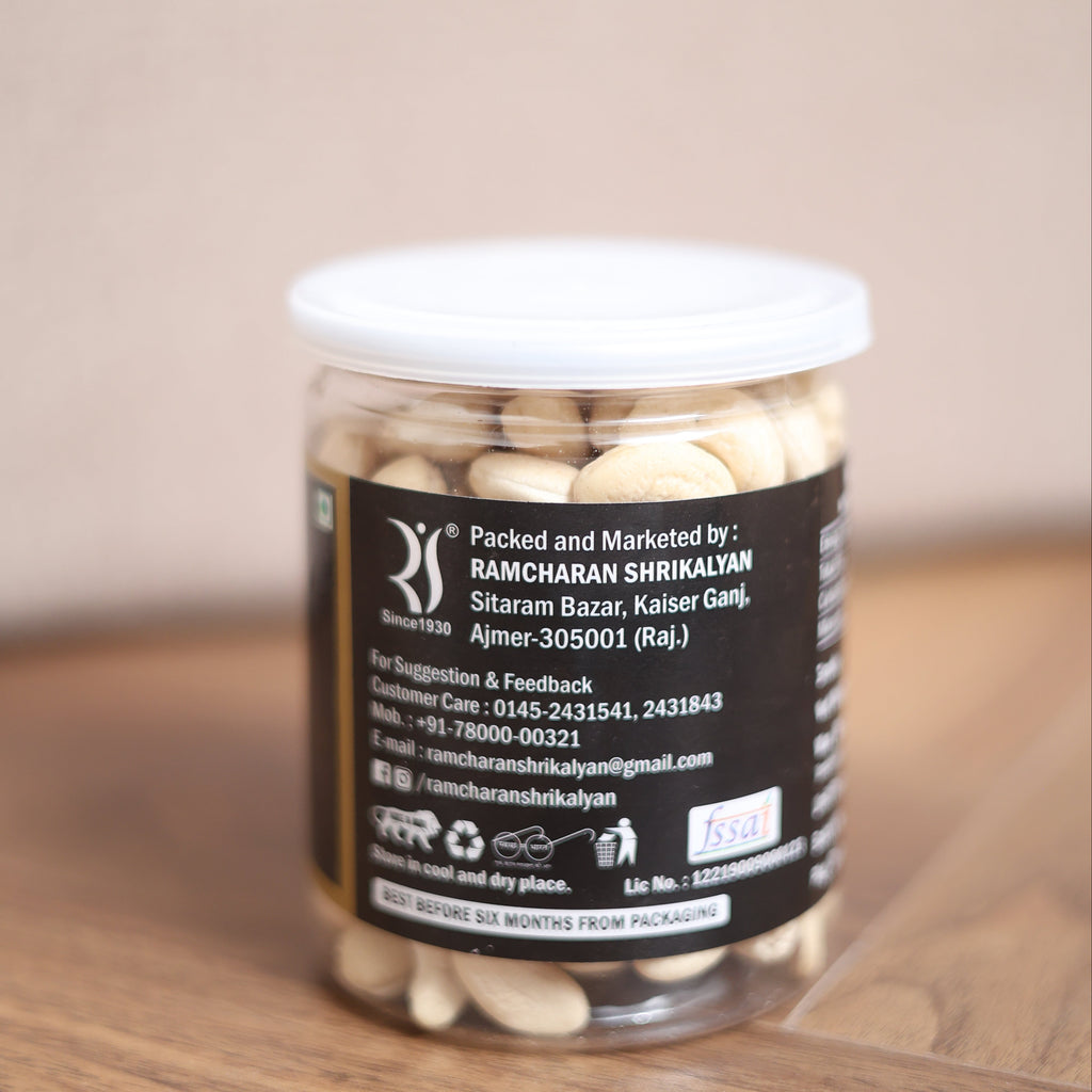 Bottle of supplements with a label on a wooden surface